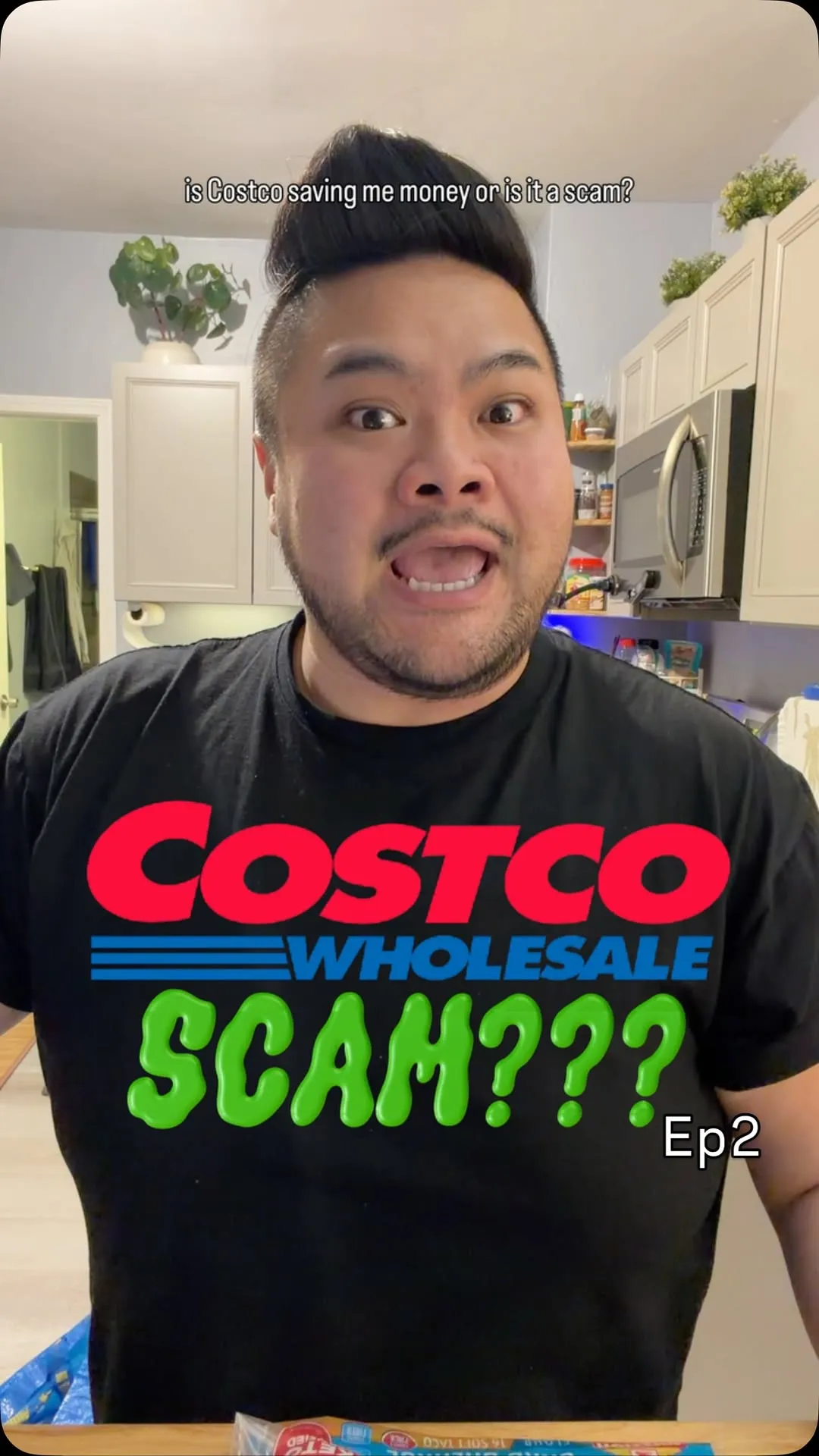 RV Mendoza wearing a Costco scam T-shirt in the cover for Breaking Even episode two.