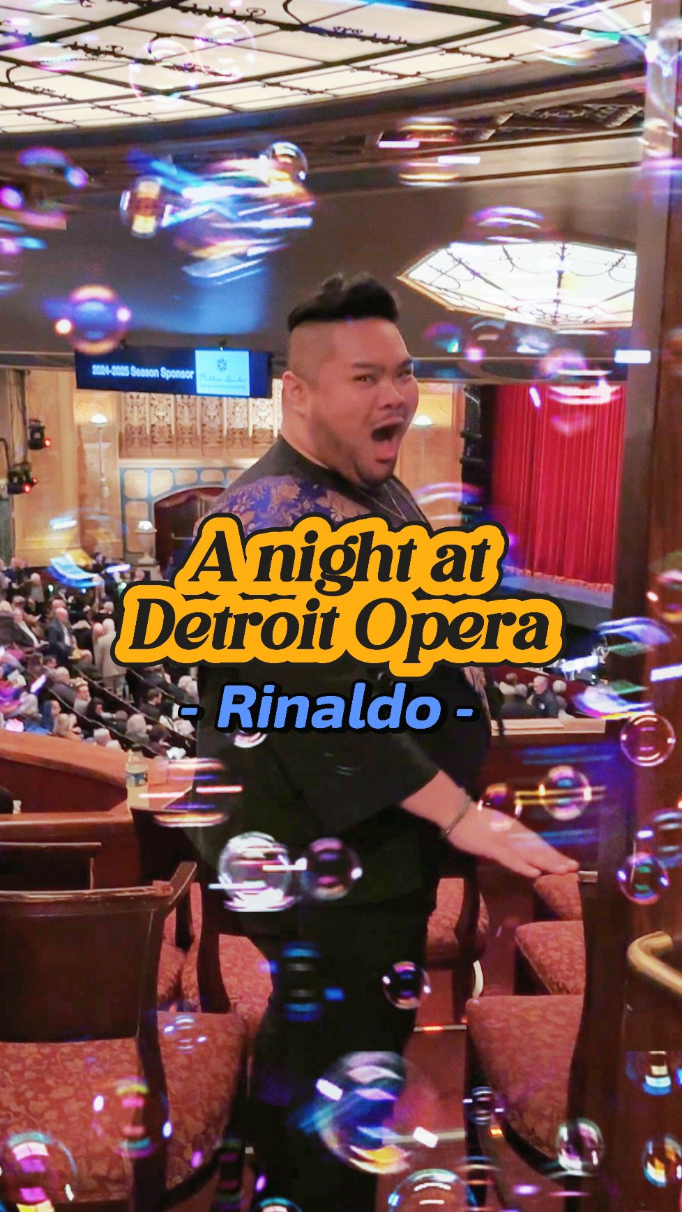 I react playfully inside the Detroit Opera House auditorium as bubbles float around me and text introduces a night at Detroit Opera for Rinaldo.