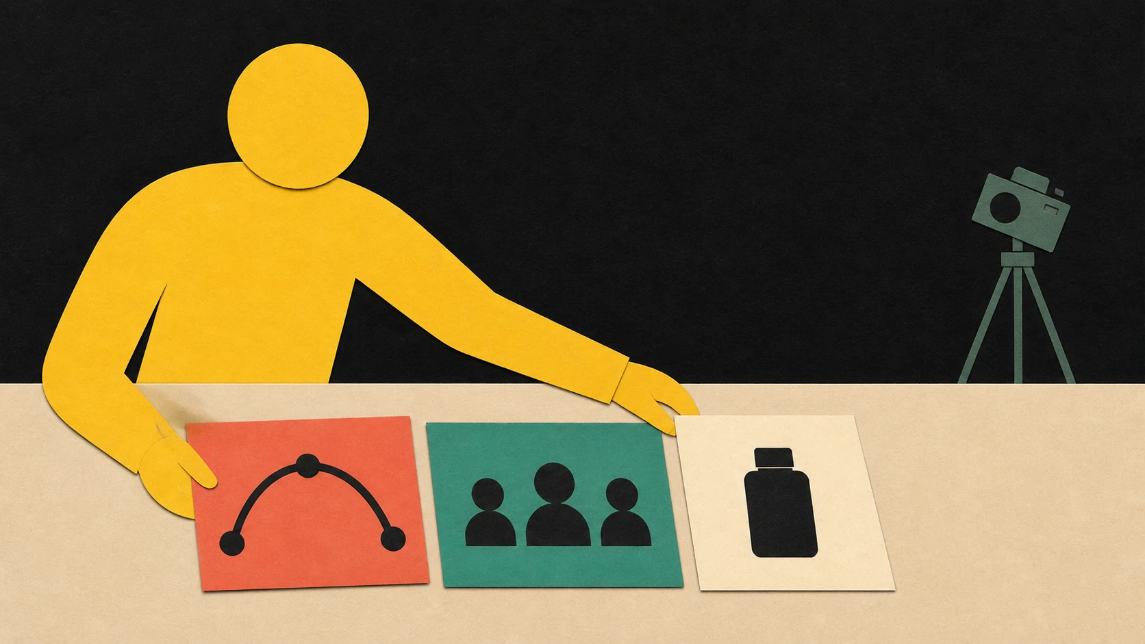 A paper-cut creator arranges story, audience, and product cards while an unused camera waits nearby.